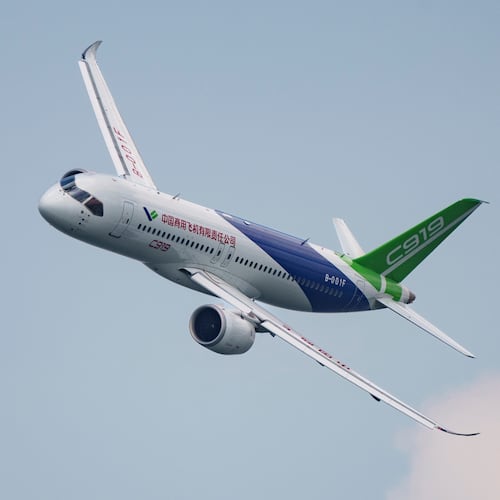FILE - A COMAC C919 aircraft flies during the first day of the Singapore Airshow in Singapore, Feb. 20, 2024. (AP Photo/Vincent Thian, File)
