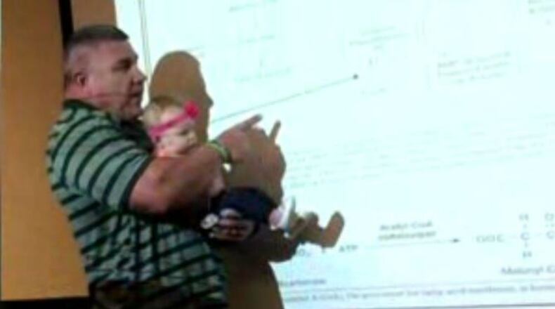 Baylor University proffesor Darryn Willoughby held his student's baby during a 55 minute lecture