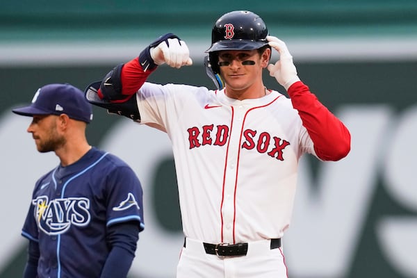 Boston Red Sox rookie Roman Anthony celebrates after his two RBI double, his first major league hit, during the first inning of a baseball game against the Tampa Bay Rays at Fenway Park, Tuesday, June 10, 2025, in Boston. (AP Photo/Charles Krupa)