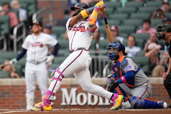 Atlanta Braves outfielder Ronald Acuña Jr. (13) hits a solo home run against the New York Mets in the first inning of a baseball game, Wednesday, June 18, 2025, in Atlanta. (AP Photo/Mike Stewart)