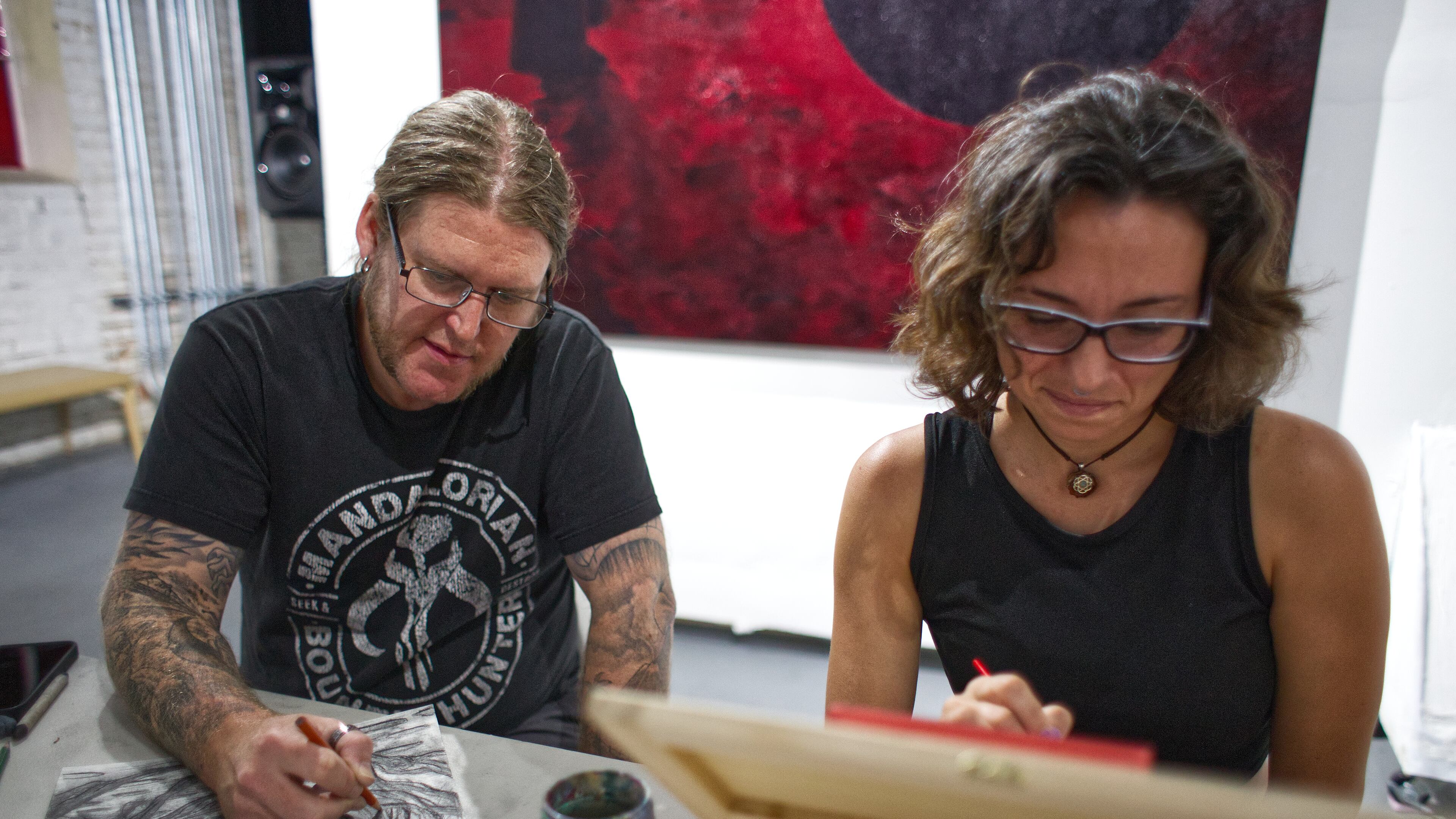 Daniel Curran and Aqua Elizabeth create during High Contrast's weekly drawing sessions hosted at eyedrum gallery. Founded in December 2023, High Contrast began as a remedy to feeling isolated or depressed while creating. (Courtesy of Dustin Timbrook)