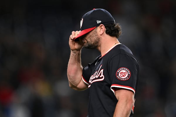 Washington Nationals pitcher Kyle Finnegan reacts as he walks off the mound during the ninth inning of a baseball game against the Atlanta Braves in Washington, Thursday, May 22, 2025. (AP Photo/Terrance Williams)