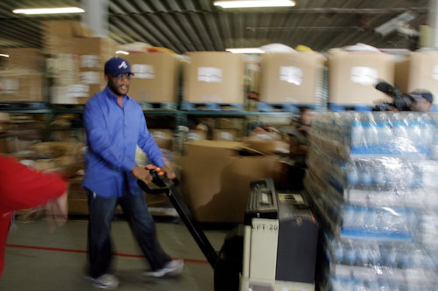 Tyler Perry donates food to Hosea Feed The Hungry
