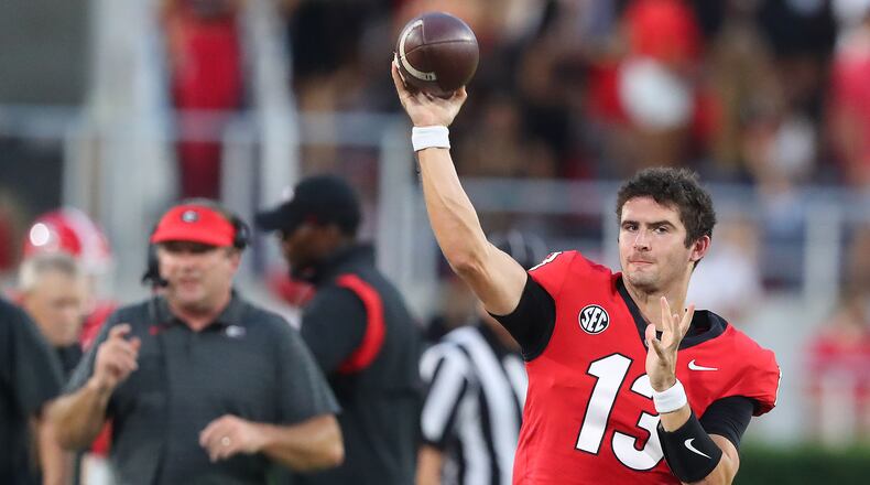 Georgia quarterback Stetson Bennett prepares to come in the game for a series against South Carolina with Kirby Smart looking on during the first quarter in a NCAA college football game on Saturday, Sept 18, 2021, in Athens. “Curtis Compton / Curtis.Compton@ajc.com”