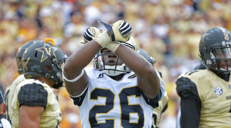 September 17, 2016 Atlanta - Georgia Tech Yellow Jackets running back Dedrick Mills (26) celebrates after he scored a touchdown in the second half at Bobby Dodd Stadium on Saturday, September 17, 2016. Georgia Tech Yellow Jackets won 38-7 over the Vanderbilt Commodores. HYOSUB SHIN / HSHIN@AJC.COM