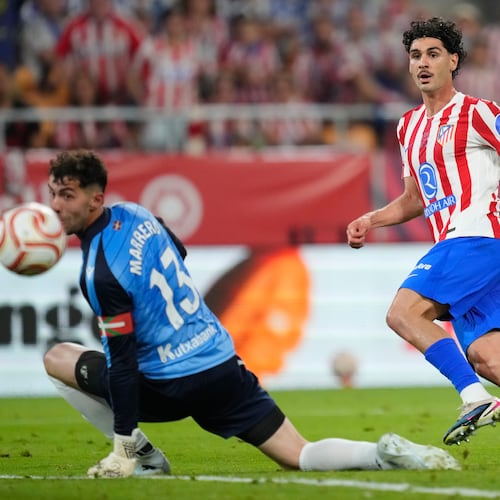 Atletico Madrid's Johnny Cardoso, right, shoots the ball past Real Sociedad's goalkeeper Unai Marrero during the Copa del Rey final soccer match between Atletico Madrid and Real Sociedad in Seville, Spain, Saturday, April. 18, 2026. (AP Photo/Jose Breton)