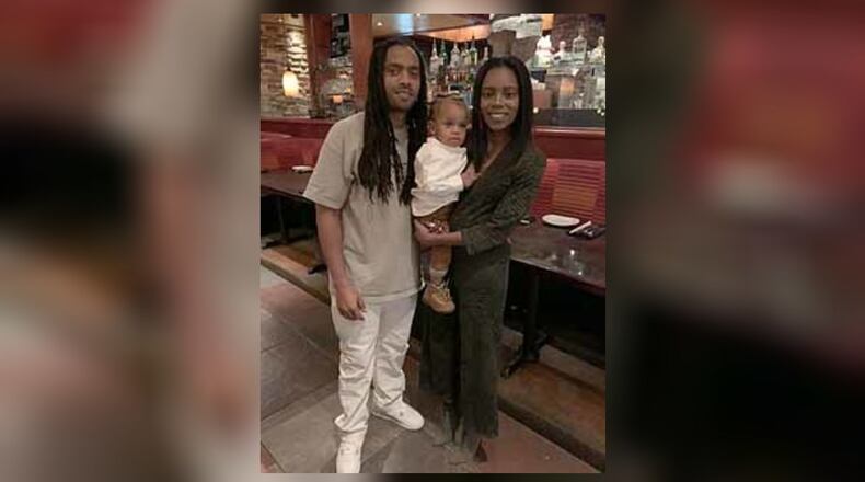Anthony Charles Hicks III, shown with his father and mother, died after falling out an open window at his Buckhead apartment complex, according to his family.