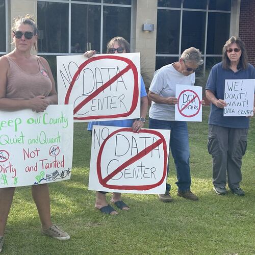 Protesters gathered outside an OpenAI data center open house in Effingham County in July. (Adam Van Brimmer/AJC)