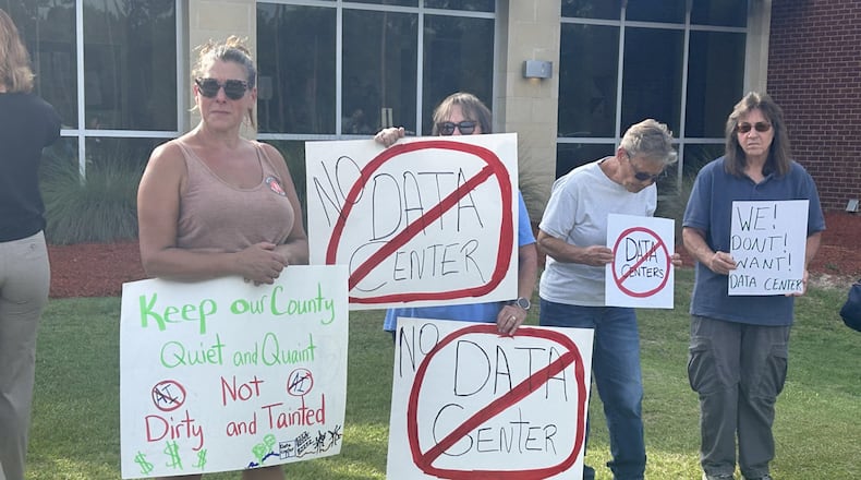 Protesters gathered outside an OpenAI data center open house in Effingham County in July. (Adam Van Brimmer/AJC)