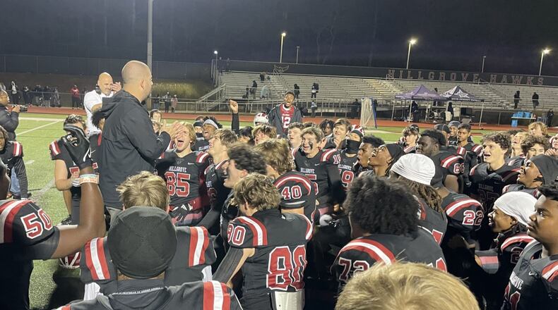 Hillgrove coach Justin DeShon talks with his team after a 35-14 victory over South Gwinnett in the first round of the Class 6A football playoffs in Powder Springs on Nov. 15, 2024.