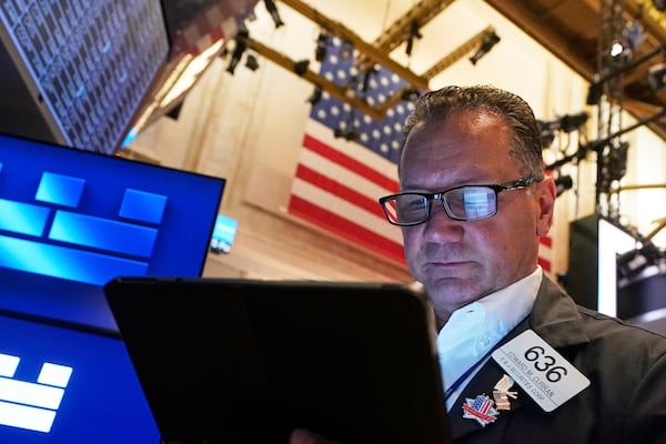 Trader Edward Curran works on the floor of the New York Stock Exchange, Friday, June 27, 2025. (AP Photo/Richard Drew)