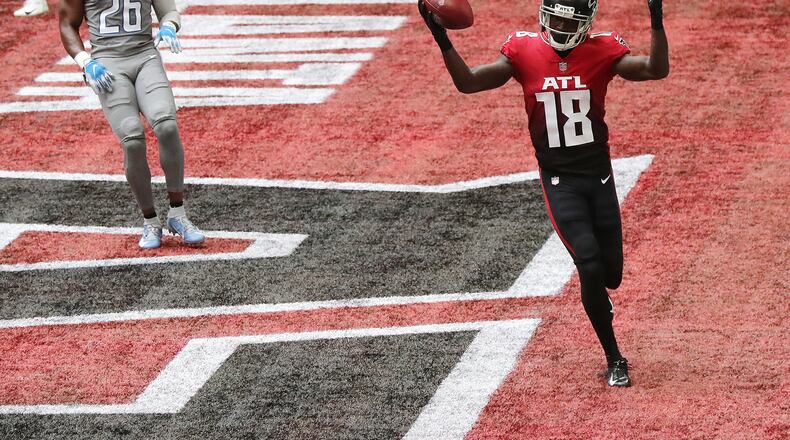 Falcons wide receiver Calvin Ridley celebrates a touchdown catch over Detroit Lions safety Duron Harmon on Oct. 25, 2020. (Curtis Compton / Curtis.Compton@ajc.com)