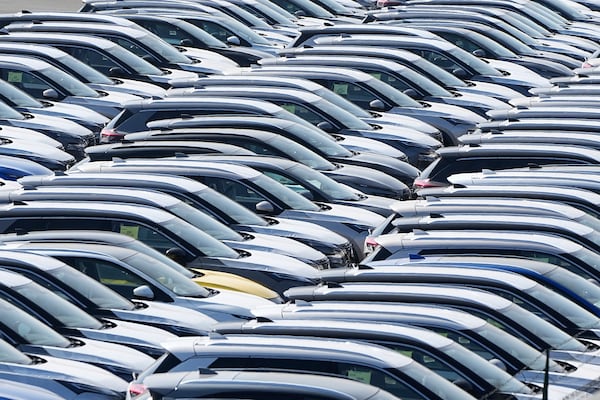 New German cars are stored at a logistic center in Duisburg, Germany, Thursday, March 27, 2025. (AP Photo/Martin Meissner)