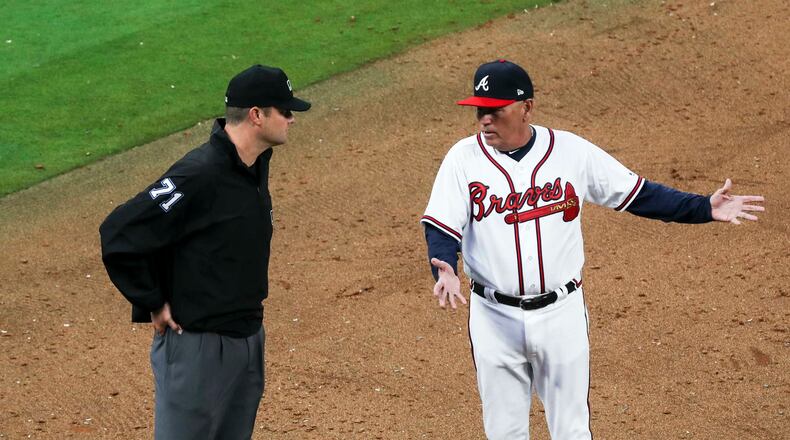 03/29/2018 -- Atlanta, GA - Braves manager Brian Snitker contests a call by the umpire during the ninth inning against the Philadelphia Phillies for the season opener game at SunTrust Park, Thursday, March 29, 2018. ALYSSA POINTER/ALYSSA.POINTER@AJC.COM