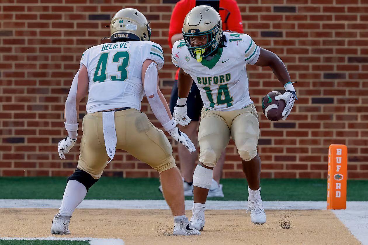 BufordÕs Tripp Chatmon (14) celebrates his touchdown with Jean-Marc Leboehi (43) during the second half of a high school football game between Buford and Gainesville, Saturday, Aug. 22, 2026, in Buford, GA. (Erik S. Lesser for the AJC)