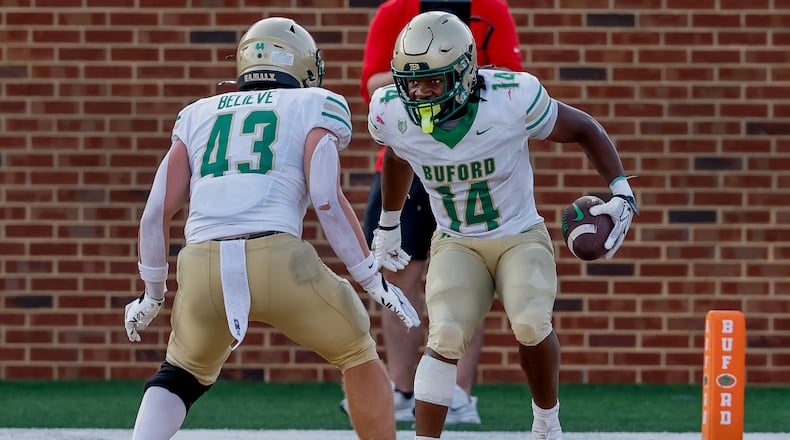 Buford's Tripp Chatmon (right) celebrates with Jean-Marc Leboehi after Chatmon scored in the second half against Gainesville on Saturday, Aug. 22, 2026, in Buford. (Erik S. Lesser for the AJC)