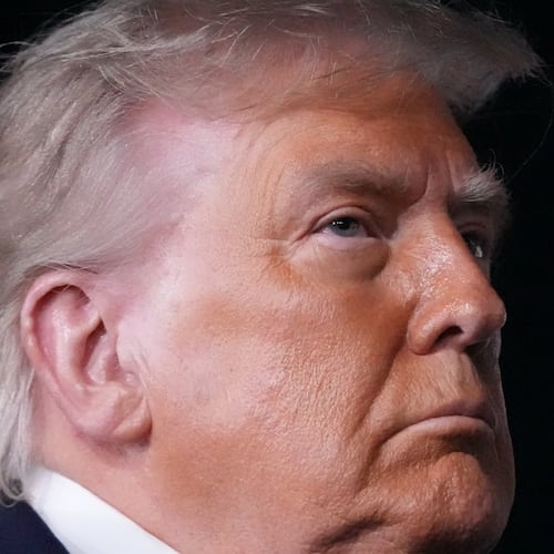 Some in the Wheeler High community are upset by President Donald Trump's visit to the school on Wednesday to promote his new savings plans. One alumna said it's a "slap in the face" to the school's diverse student body. (Mark Schiefelbein/AP)