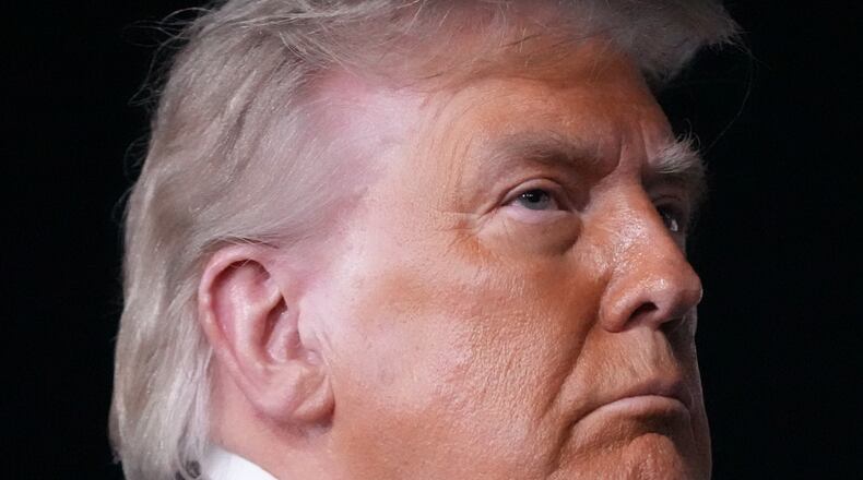 Some in the Wheeler High community are upset by President Donald Trump's visit to the school on Wednesday to promote his new savings plans. One alumna said it's a "slap in the face" to the school's diverse student body. (Mark Schiefelbein/AP)