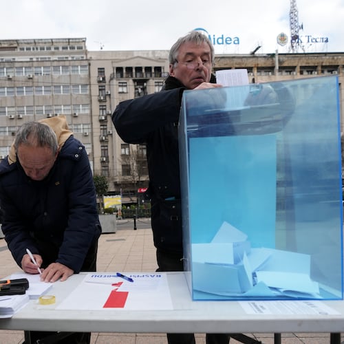 Serbia's protesting university students collect signatures for their request for an early parliamentary election, in Belgrade, Serbia, Sunday, Dec. 28, 2025. (AP Photo/Darko Vojinovic)