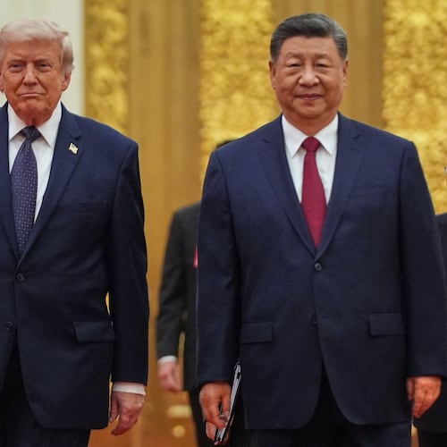 FILE - President Donald Trump, left, and Chinese President Xi Jinping arrive a state dinner at the Great Hall of the People May 14, 2026, in Beijing. (AP Photo/Mark Schiefelbein)
