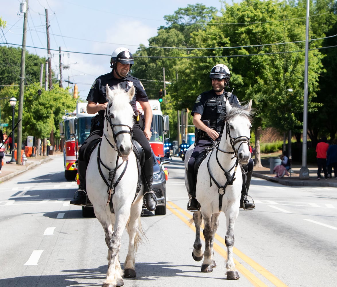 Police officers ride horses during the Atlanta Public School parade on Saturday, April 22, 2023. The parade celebrated the 150th anniversary of Atlanta Public Schools and featured students, teachers and other members of the APS community. CHRISTINA MATACOTTA FOR THE ATLANTA JOURNAL-CONSTITUTION