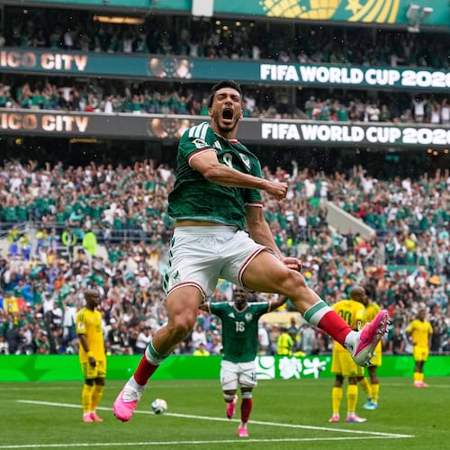 Mexico's Raul Jimenez celebrates after scoring his side's second goal during the World Cup Group A soccer match between Mexico and South Africa in Mexico City, Thursday, June 11, 2026. (AP Photo/Natacha Pisarenko)