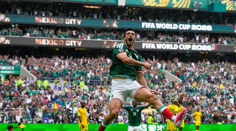 Mexico's Raul Jimenez celebrates after scoring his side's second goal during the World Cup Group A soccer match between Mexico and South Africa in Mexico City, Thursday, June 11, 2026. (AP Photo/Natacha Pisarenko)