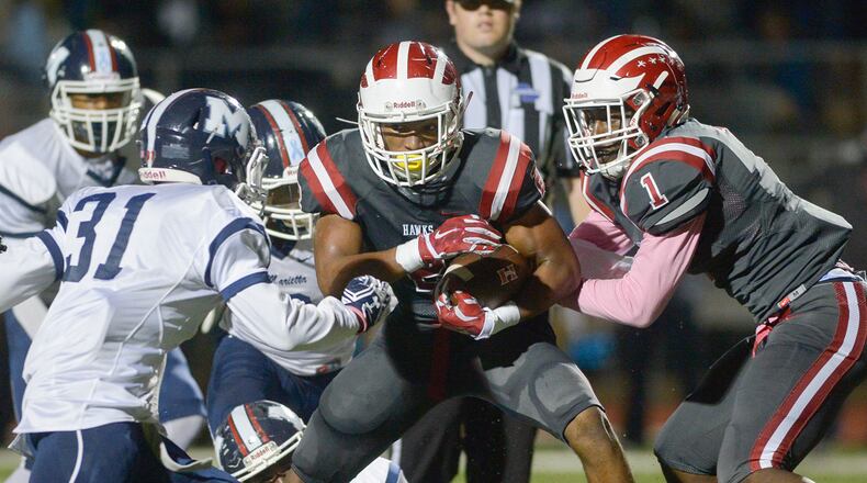 Powder Springs, Ga. -- Hillgrove sophomore RB Jaylen McCollough (2) punches through Marietta’s defense in the first half of their game Friday, October 14, 2016. SPECIAL/Daniel Varnado