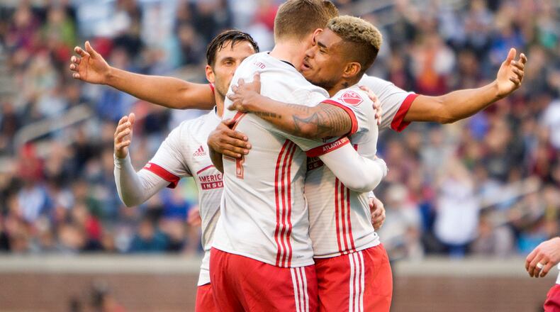 FEBRUARY 11, 2017 CHATTANOOGA TN Atlanta United players celebrate the third goal scored by forward Josef Martinez (right).