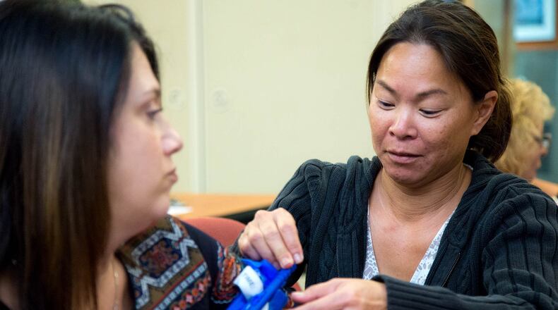Gracie Wong (right) practices applying a tourniquet on Jennifer Ray during a training to “Stop the Bleed” in Palm Beach Gardens, Florida on January 29, 2018. Wong and Ray work in the finance department and were required with all Palm Beach Gardens city employees to attend active shooter and bleeding control courses. (Allen Eyestone / The Palm Beach Post)