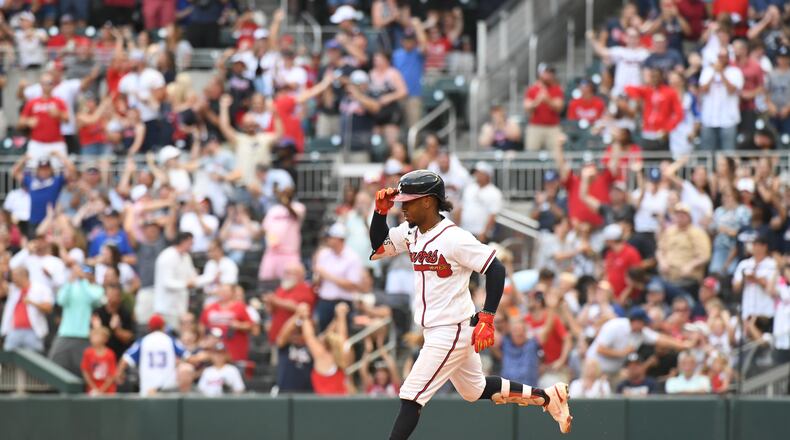 Braves' Ozzie Albies circles the bases after hitting a home run at Truist Park on Saturday, June 11, 2022. (Hyosub Shin / Hyosub.Shin@ajc.com)