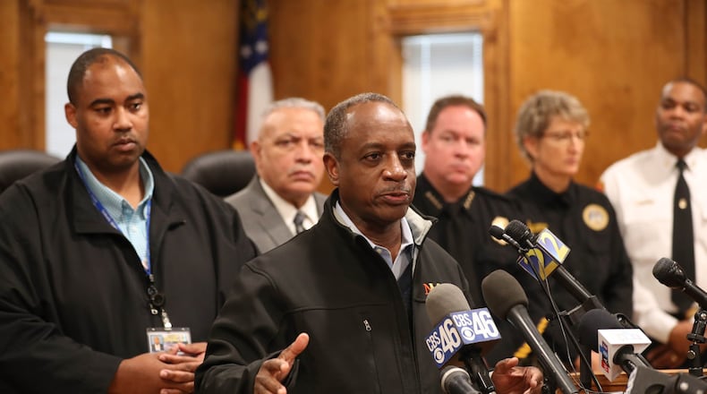 DeKalb County CEO Michael Thurmond speaks during a press conference to discuss the water main break on Buford Highway at the Doraville City Council Chambers Wednesday, March 7, 2018, in Doraville. Reginald Wells, left, was at the time acting director of watershed management. PHOTO / JASON GETZ