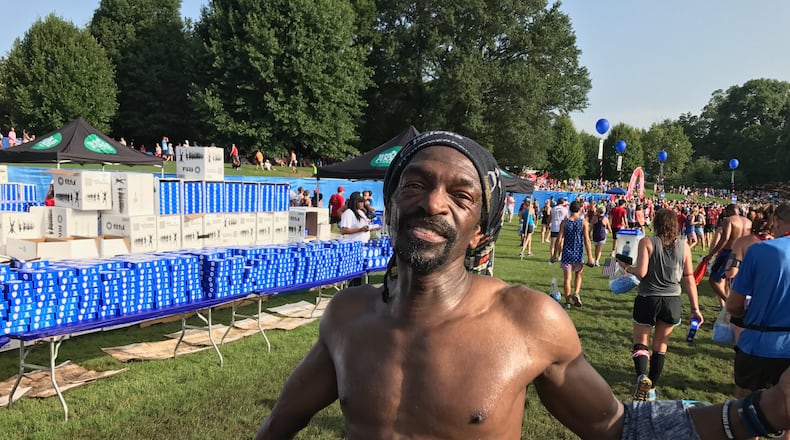 Eli Hamner of East Point celebrates his AJC Peachtree Road Race finish.