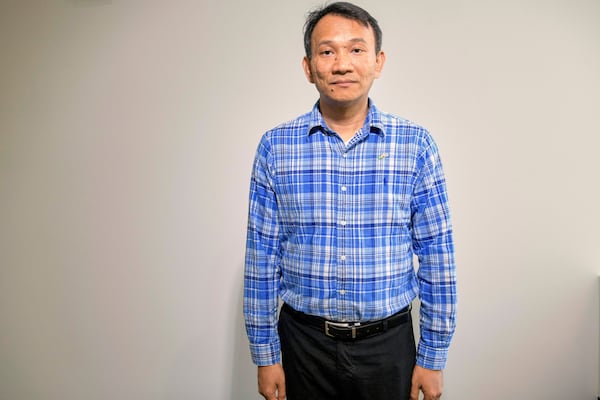 Vuthy Tha, a Cambodian reporter at Radio Free Asia who spent 7 years in a Thai refugee camp before arriving in the United States, poses for a portrait, Tuesday, April 1, 2025, at the RFA office in Washington. (AP Photo/Rod Lamkey, Jr.)