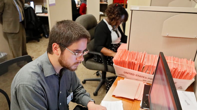11/7/18 - Atlanta - David Laurencio and other registration specialists check provisional ballots at the Fulton County Board of Registration and Elections   BOB ANDRES / BANDRES@AJC.COM