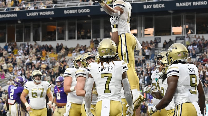 September 9, 2022 Atlanta - Georgia Tech's running back Dontae Smith (4) celebrates with teammates after scoring a touchdown during the first half of an NCAA college football game at Georgia Tech's Bobby Dodd Stadium in Atlanta on Saturday, September 10, 2022. (Hyosub Shin / Hyosub.Shin@ajc.com)