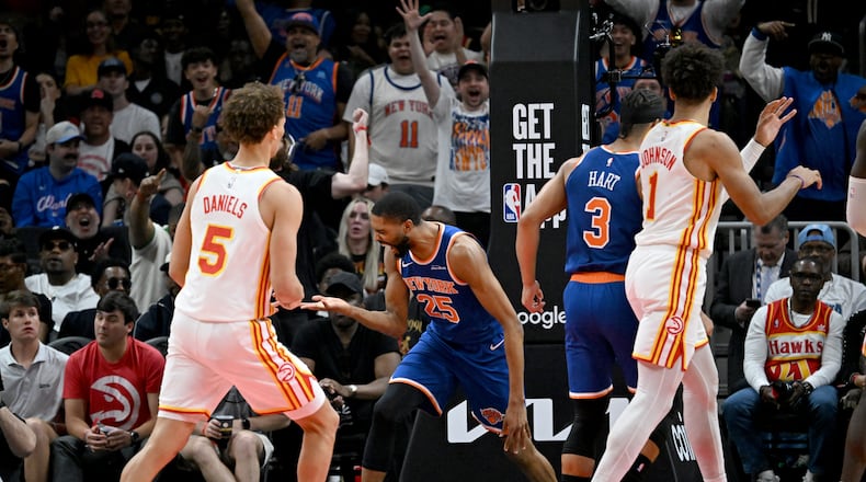 New York Knicks guard/forward Mikal Bridges reacts after dunking the ball during the first half of Game 6 of a first-round NBA playoff series at State Farm Arena on Thursday, April 30, 2026, in Atlanta. (Hyosub Shin/AJC)