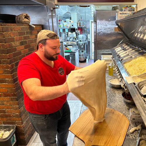 Salvatore Lo Duca makes pizza at Lo Duca Pizza Tuesday, May 12, 2026, in the Brooklyn borough of New York. (AP Photo/David R. Martin)