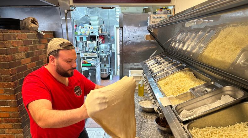 Salvatore Lo Duca makes pizza at Lo Duca Pizza Tuesday, May 12, 2026, in the Brooklyn borough of New York. (AP Photo/David R. Martin)
