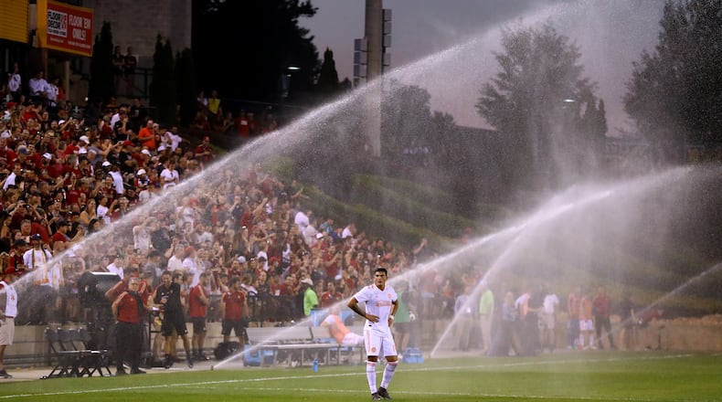 Atlanta United forward Brandon Vazquez looks on as the sprinklers come on during the match against Charleston Battery causing a delay during the second half in a U.S. Open Cup match on Wednesday, June 6, 2018, in Kennesaw.  Curtis Compton/ccompton@ajc.com