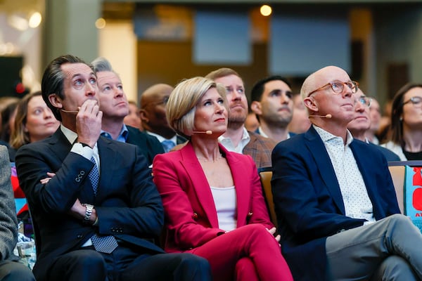 President and CEO Katie Kirkpatrick, center, along with 2026 Board Chair Rich McKay and 2025 Board Chair Ryan Marshall, look at the screen during the Metro Atlanta Chamber’s annual meeting at the College Football Hall of Fame on Thursday, Nov. 13, 2025, in Atlanta.
(Miguel Martinez/AJC)