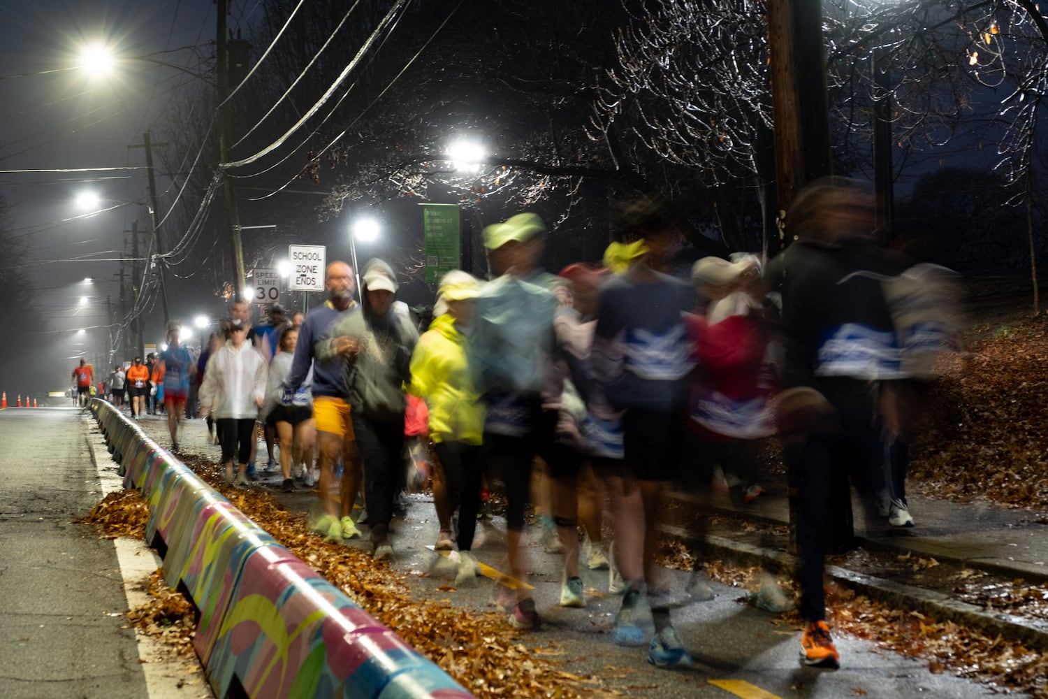Runners make their way to the start of the Polar Opposite Peachtree Road Race on Saturday, Jan. 3, 2026, in Atlanta. (Ben Gray for the AJC)