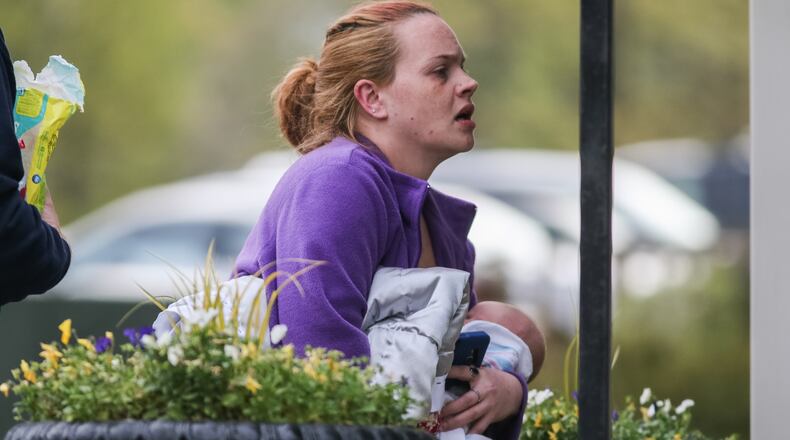 A 4-week-old boy was reunited with his mother after a hostage situation near Peachtree Corners early Wed., April 6, 2016. JOHN SPINK / JSPINK@AJC.COM