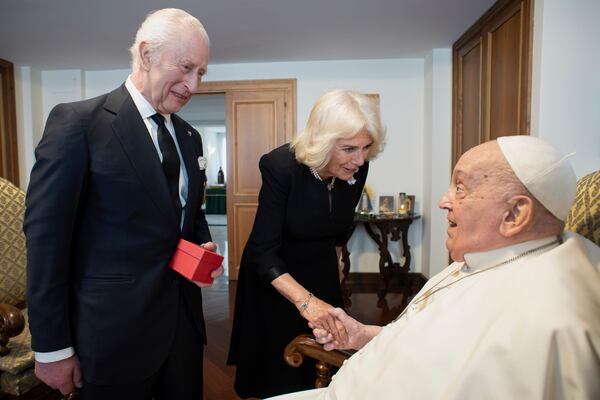 In this image released by Vatican Media, Britain's King Charles III and Queen Camilla meet Pope Francis at The Vatican, Wednesday, April 9, 2025. (Vatican Media via AP)