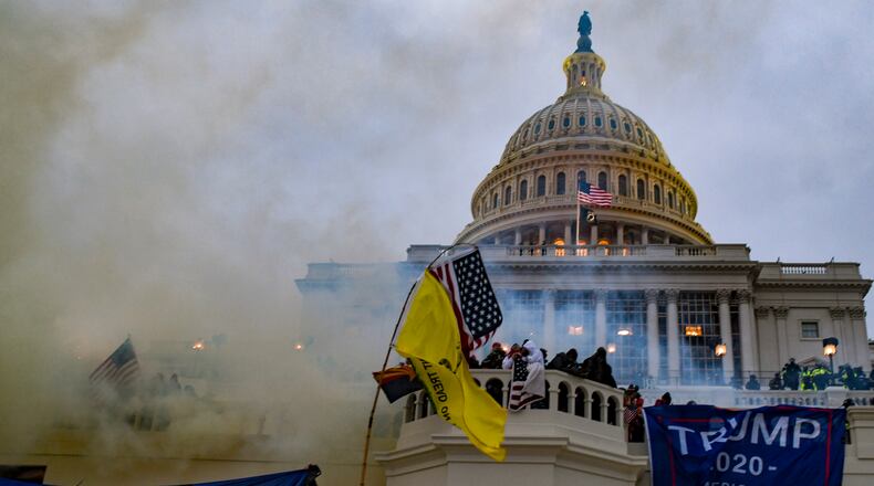 FILE — Supporters of former President Donald Trump attack the U.S. Capitol in Washington, Jan. 6, 2021. When the seditious conspiracy trial of five members of the Oath Keepers militia opened in October 2022 in Washington, prosecutors focused much of their attention on the organization’s leader, Stewart Rhodes. But much of the trial will hinge on the actions of four codefendants. (The New York Times)