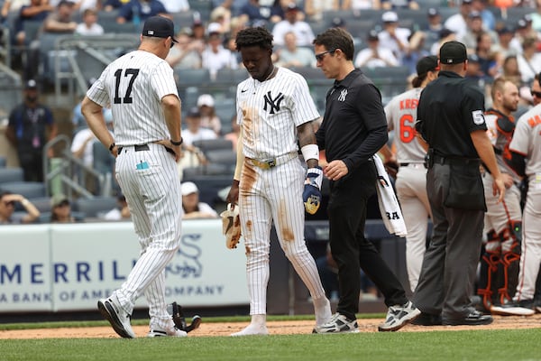 New York Yankees' Jazz Chisholm Jr. walks off the field after colliding with Baltimore Orioles catcher Maverick Handley while scoring during the second inning of a baseball game Sunday, June 22, 2025, in New York. (AP Photo/Pamela Smith)