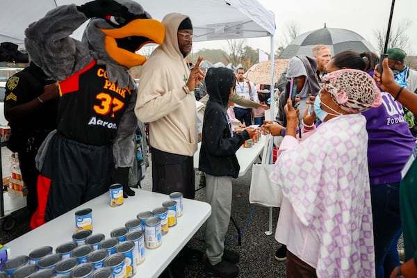 Tauheed Epps, professionally known as 2 Chainz, poses for a photo at the “Greens and Things" Thanksgiving giveaway event on Tuesday, Nov. 24, 2025. (Miguel Martinez/ AJC)