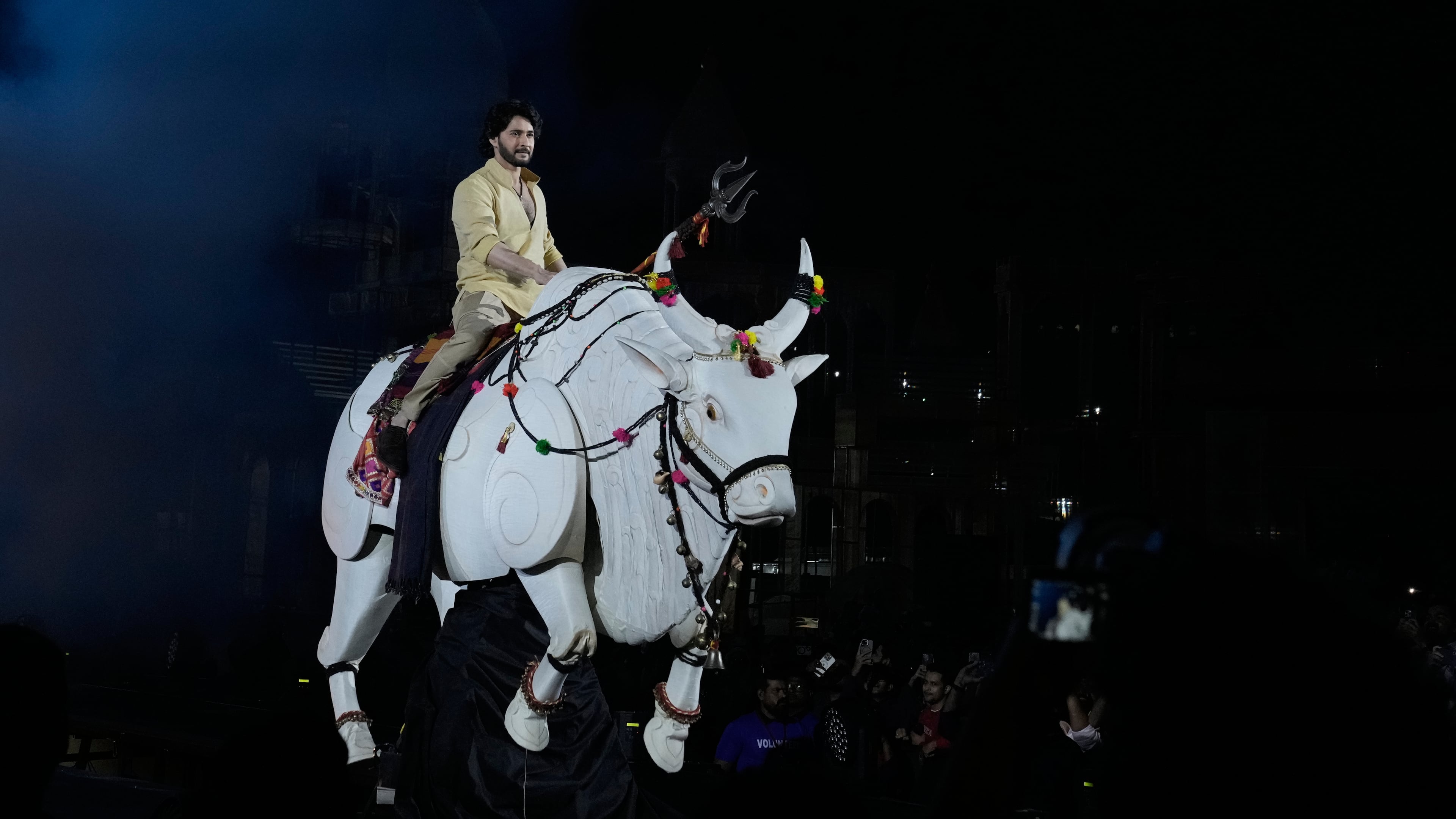 Tollywood superstar Mahesh Babu rides a mechanical bull at the unveiling of first look of film "Varanasi" in Hyderabad, India, Saturday, Nov. 15, 2025. (AP Photo/Mahesh Kumar A.)