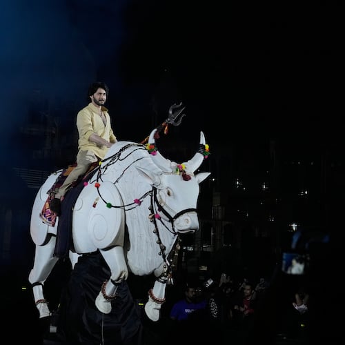Tollywood superstar Mahesh Babu rides a mechanical bull at the unveiling of first look of film "Varanasi" in Hyderabad, India, Saturday, Nov. 15, 2025. (AP Photo/Mahesh Kumar A.)