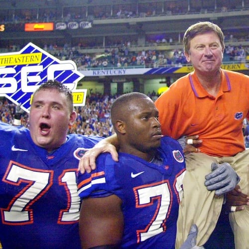 In this Dec. 2, 2000, file photo, Florida head coach Steve Spurrier is carried off the field after the Gators downed Auburn 28-6 in the SEC Championship at the Georgia Done in Atlanta. (John Bazemore/AP)